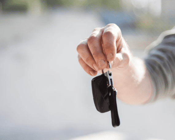 a person holding a car key